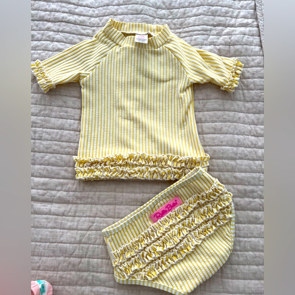 Ruffle Butts seersucker two piece toddler bathing suit.